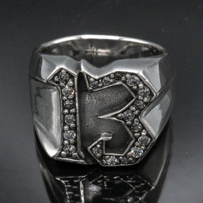 Carved 13 ring made from 925 sterling silver, encrusted in 17 clear  cubic zirconia stones.  Great statement piece, looks great on
