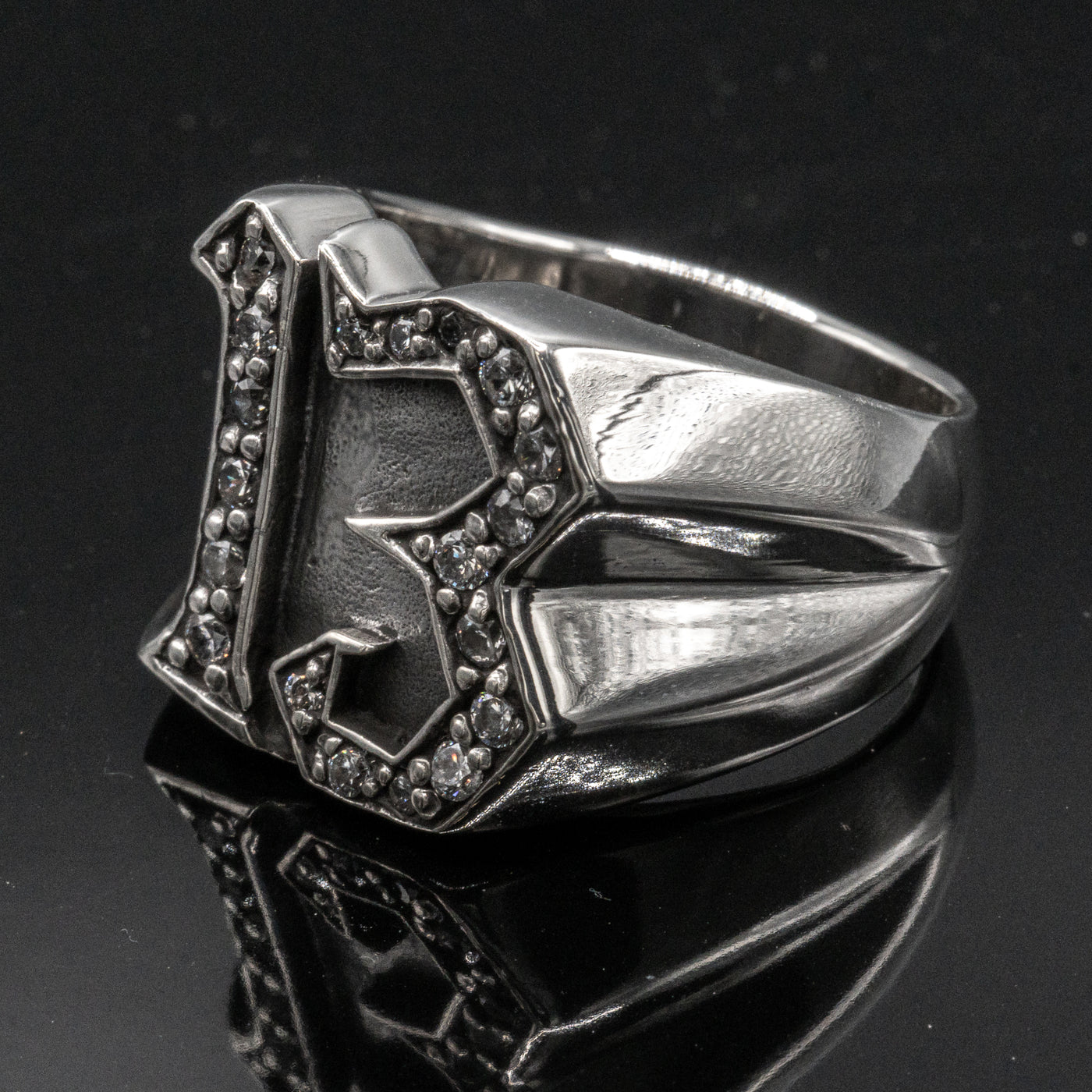 Carved 13 ring made from 925 sterling silver, encrusted in 17 clear  cubic zirconia stones.  Great statement piece, looks great on

