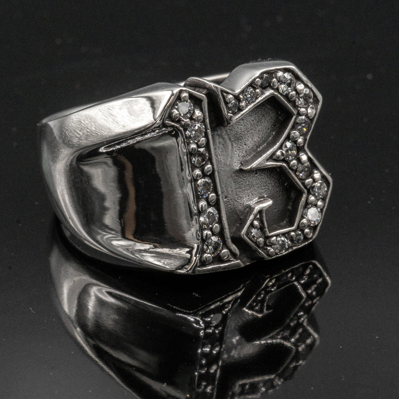 Carved 13 ring made from 925 sterling silver, encrusted in 17 clear  cubic zirconia stones.  Great statement piece, looks great on
