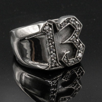 Carved 13 ring made from 925 sterling silver, encrusted in 17 clear  cubic zirconia stones.  Great statement piece, looks great on
