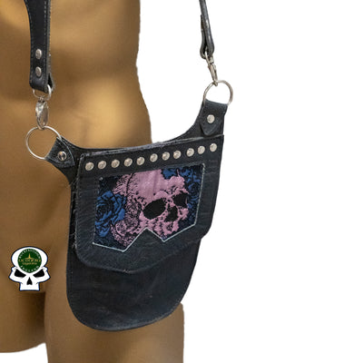 Real Leather back holster to keep your belongings and valuables safe.  It has an adjustable strap with buckles at the front with chrome effect studs in various places, rings that sit on the shoulders and another buckle securing at the back.  on the side is a decorative pouch for your valuables to keep them out of site.  This one has a skull & blue rose detail on the pouch