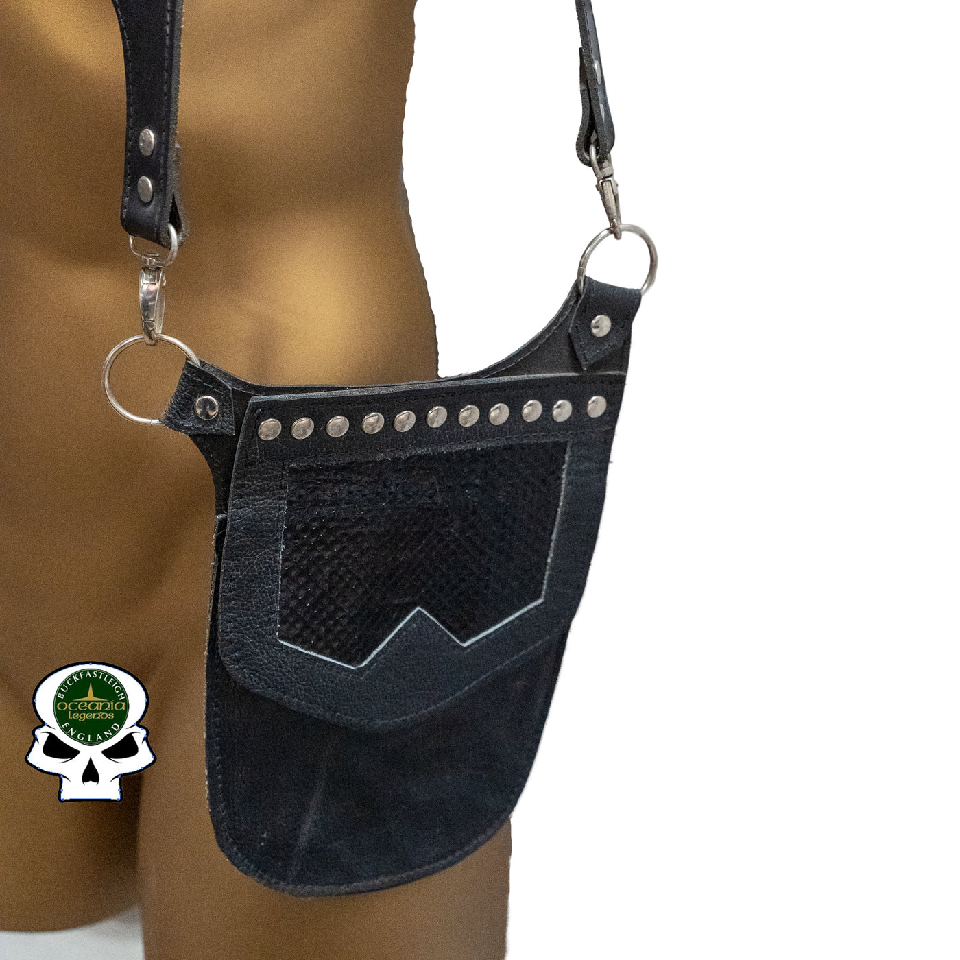 Real Leather back holster to keep your belongings and vaulables safe.  It has an adjustable strap with buckles at the front with chrome effect studs in various places, rings that sit on the shoulders and another buckle securing at the back.  on the side is a decorative pouch for your valuables to keep them out of site.  This one has a black real python snakeskin