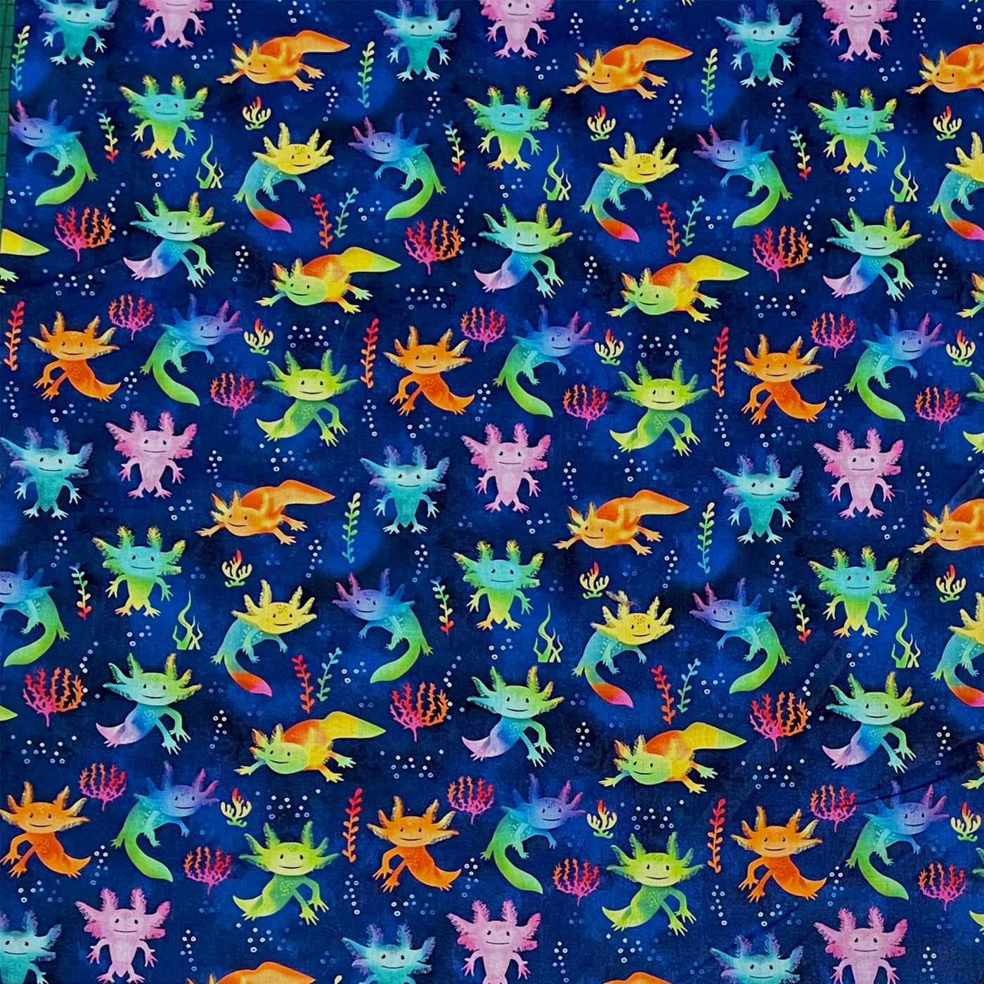 Axolotl designer fabric.  Beautiful bright colours. Fun Design with axolotl, seaweed and bubbles