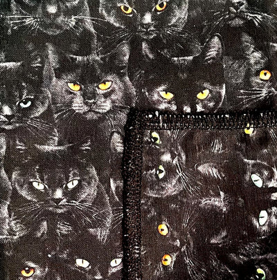 Bandana design with rows of black cats with different coloured eyes.  100% Cotton, approx. 22" x 22"