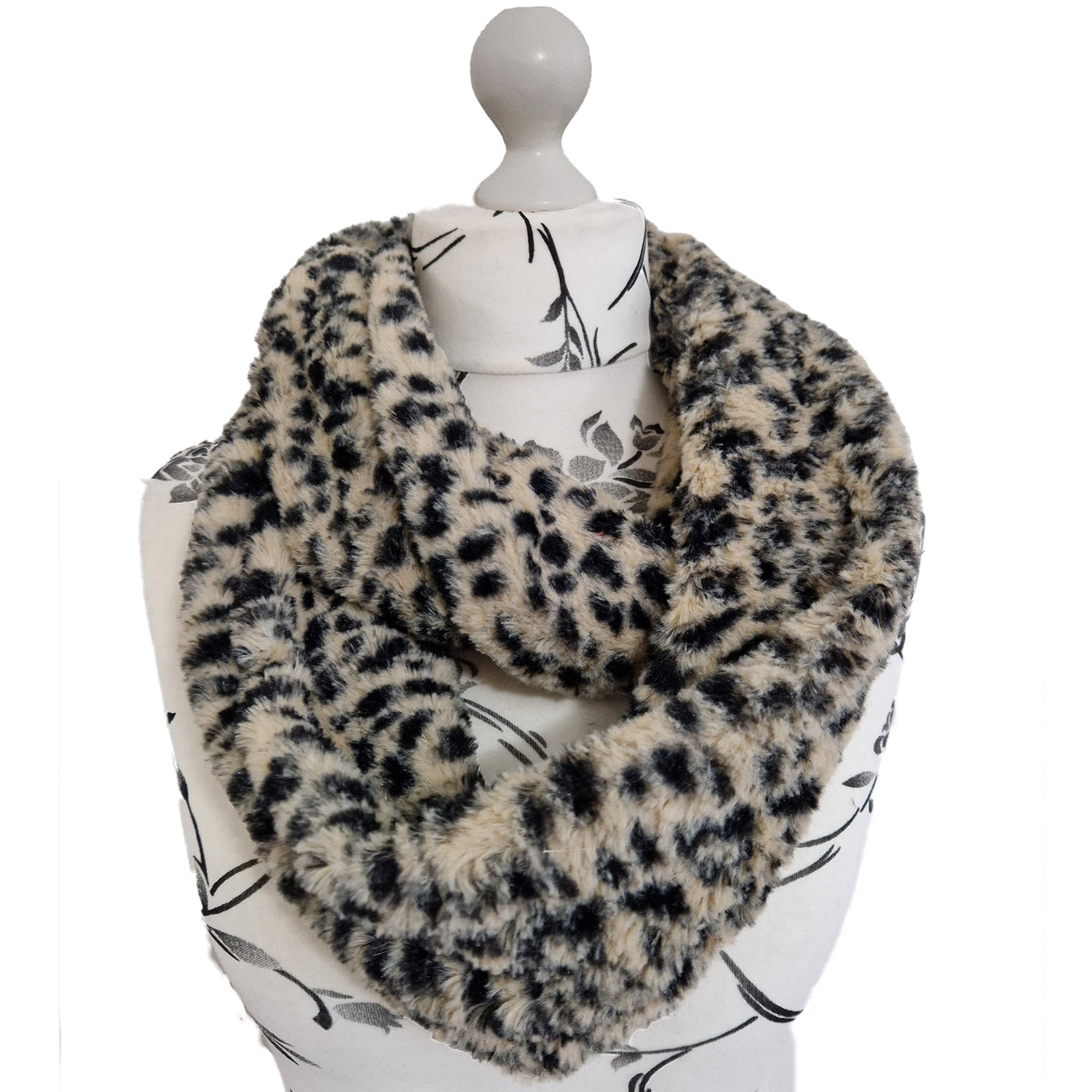 Infinity Scarf handmade from an ultra soft and fluffy leopard faux fur fabric in beige with black markings. Wear it long or wrap it around your neck 2-3 times to keep you toasty warm
