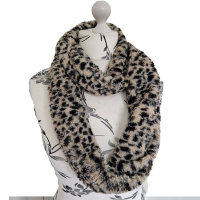 Infinity Scarf handmade from an ultra soft and fluffy leopard faux fur fabric in beige with black markings. Wear it long or wrap it around your neck 2-3 times to keep you toasty warm
