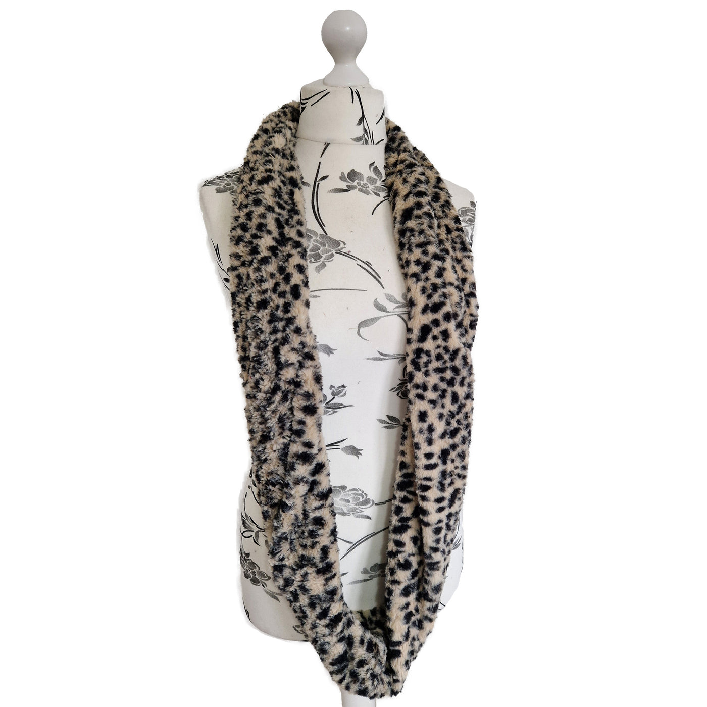 Infinity Scarf handmade from an ultra soft and fluffy leopard faux fur fabric in beige with black markings. Wear it long or wrap it around your neck 2-3 times to keep you toasty warm
