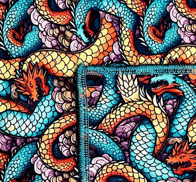 Entwined Chinese dragons cover this bandana which is approx. 21.5 x 21.5". In gorgeous shades of blues & oranges