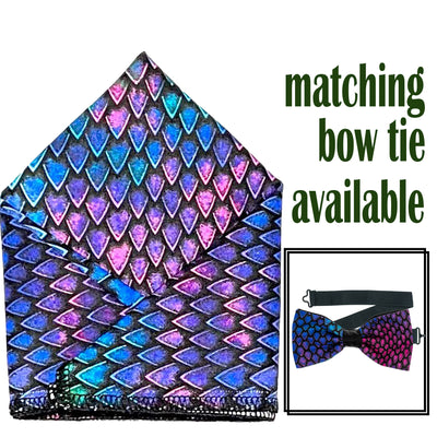 Dragon or Dinosaur Scale design with a gradient of bright colours in blues, pinks & purples on our handmade bow tie & pocket square.  The bow tie is on a sliding ribbon to easily attach. The pocket square is  25cmx25cm, pop it straight in your pocket
