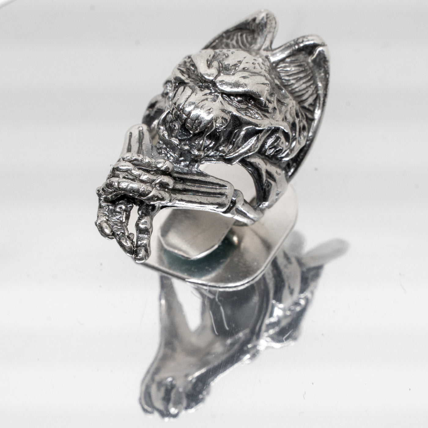Winged gargoyle ring made from 925 solid sterling ring. Hideous beast with hands crossed and baring teeth, ghoulish character.  Available in sizes M - Z+5.  Please ask for alternative sizes.
