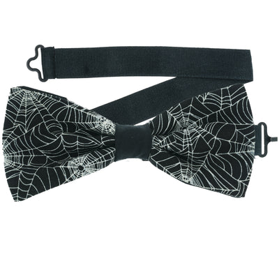 Spider's Web design on black fabric.  The spider webs actually glow in the dark on our pre-tied bow tie.  The bow tie is on a sliding ribbon to place and attach easily. Handmade from 100% Cotton
