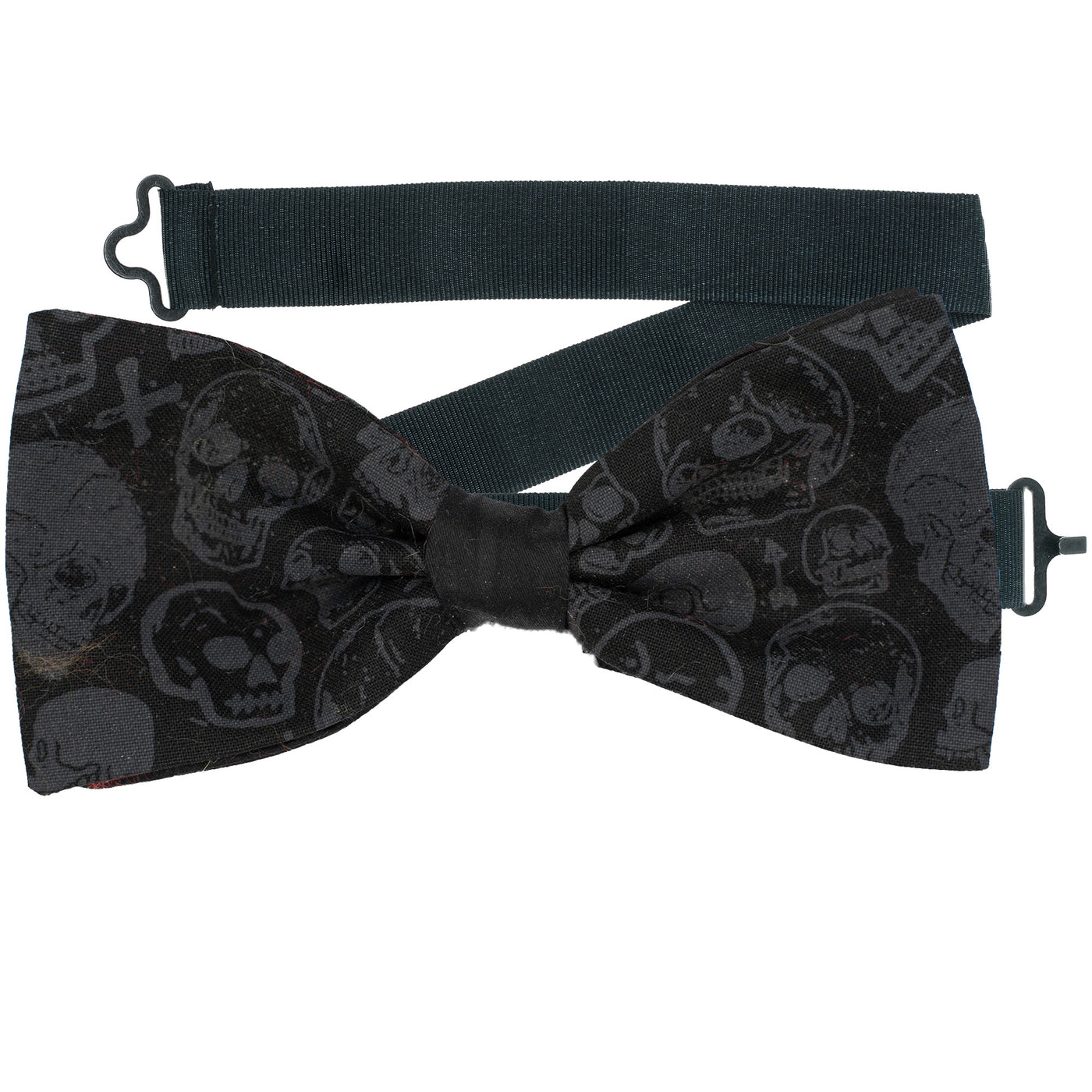 Skulls, sugar skulls, arrows and crosses in grey on black fabric design on our pre-tied bow tie.  The bow tie is on a sliding ribbon to place and attach easily. Handmade from 100% Cotton
