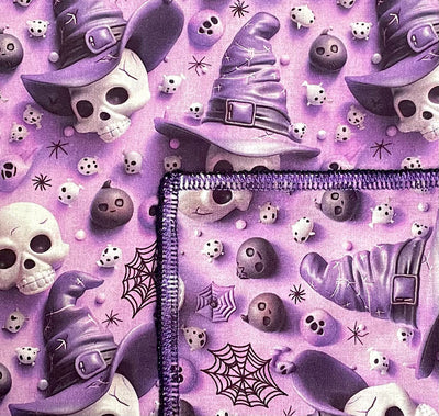 Perfect for halloween, skulls wearing witch hats, spider webs, spooky faces & pumpkins printed in a 3D effect on purple fabric. Handmade square bandana approx. 21.5" x 21.5" machine washable 100% cotton
