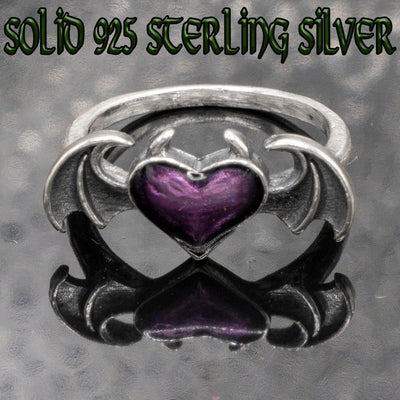 Devil horned Heart Ring. Made from 925 solid sterling ring.  With bat wings featured on the sides of the enamelled purple heart it makes for a great Halloween or Gothic accessory Available in sizes K - X.  Please ask for alternative sizes.
