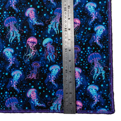 21" X 21" Cotton bandana hand made from jellyfish fabric.  A mass of jellyfish in shades of blues, turquoise & purples with a splattering of bubbles all over.