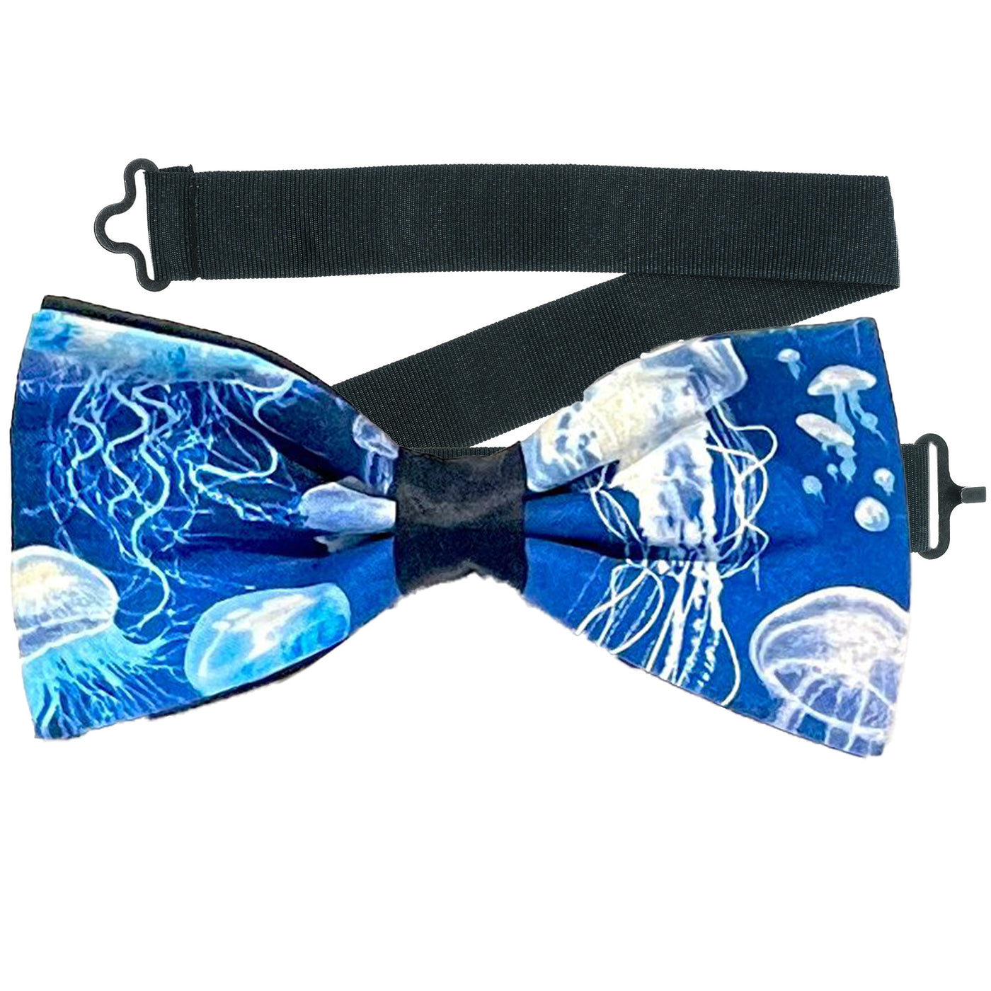 Lovely design with swarms of jellyfish swimming on a sea blue fabric on our pre-tied bow tie.  The bow tie is on a sliding ribbon to place and attach easily. Handmade from 100% Cotton
