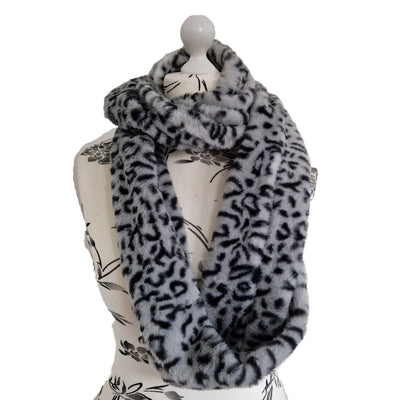 Infinity Scarf handmade from an ultra soft and fluffy leopard faux fur fabric in grey with black markings. Wear it long or wrap it around your neck 2-3 times to keep you toasty warm
