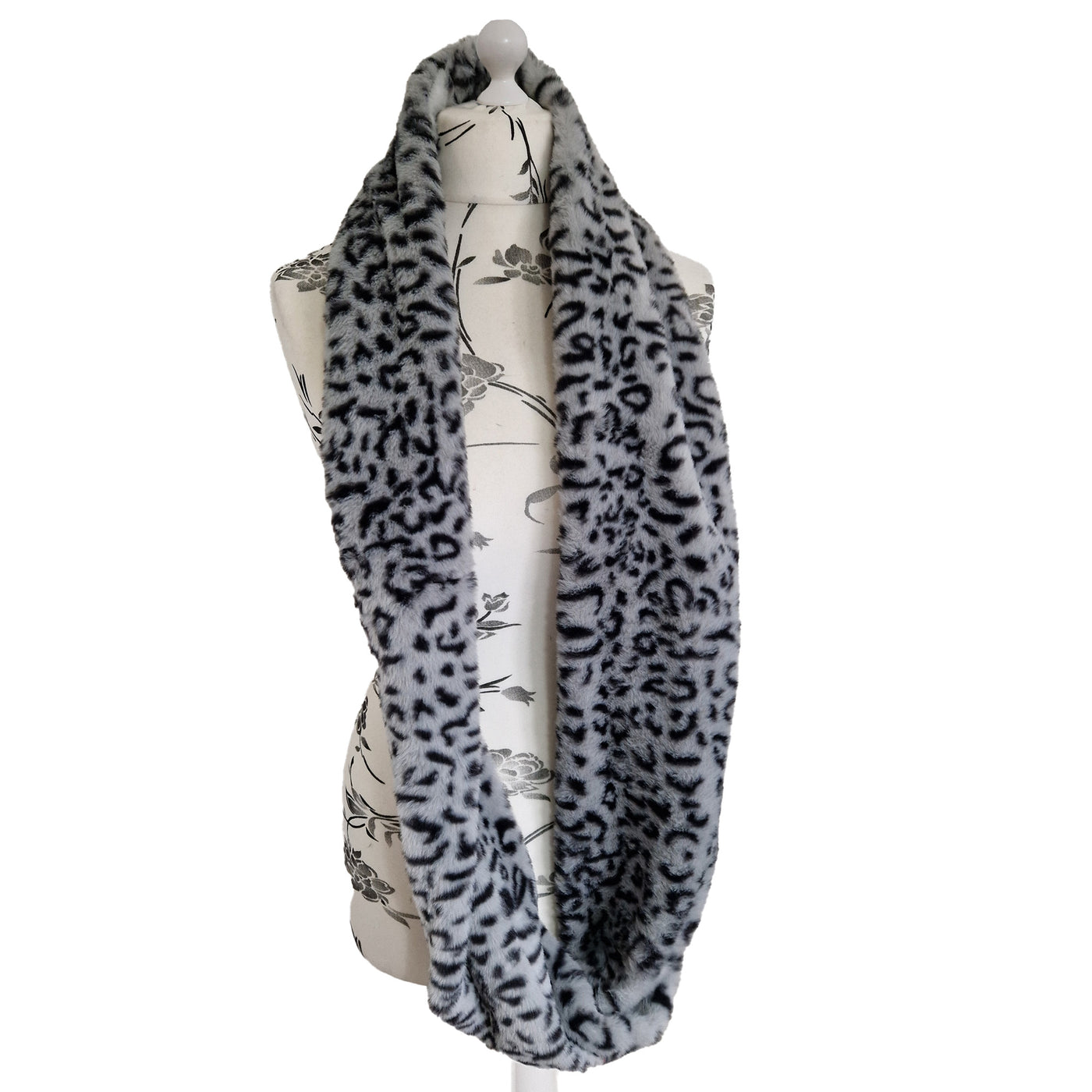 Infinity Scarf handmade from an ultra soft and fluffy leopard faux fur fabric in grey with black markings. Wear it long or wrap it around your neck 2-3 times to keep you toasty warm
