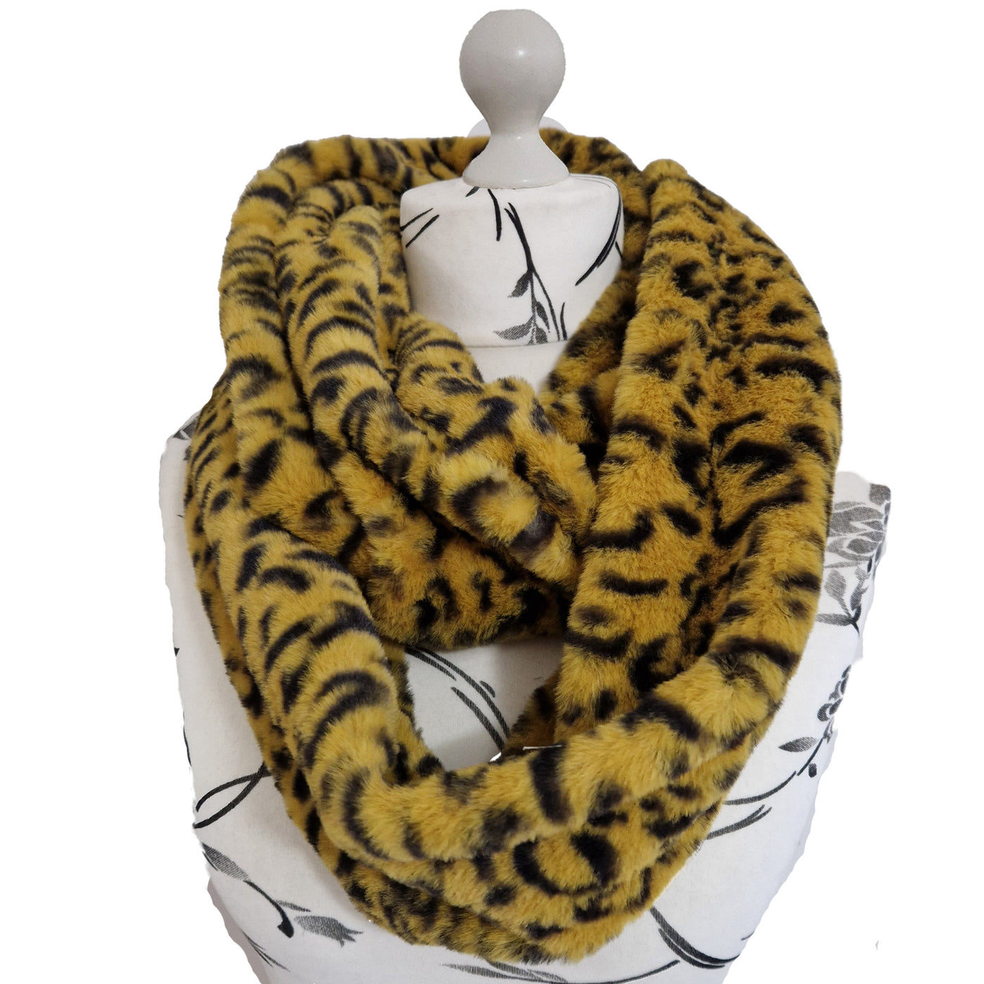 Infinity Scarf handmade from an ultra soft and fluffy leopard faux fur fabric in brown with black markings. Wear it long or wrap it around your neck 2-3 times to keep you toasty warm
