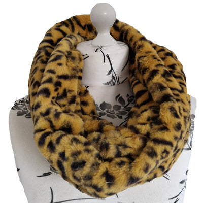 Infinity Scarf handmade from an ultra soft and fluffy leopard faux fur fabric in brown with black markings. Wear it long or wrap it around your neck 2-3 times to keep you toasty warm
