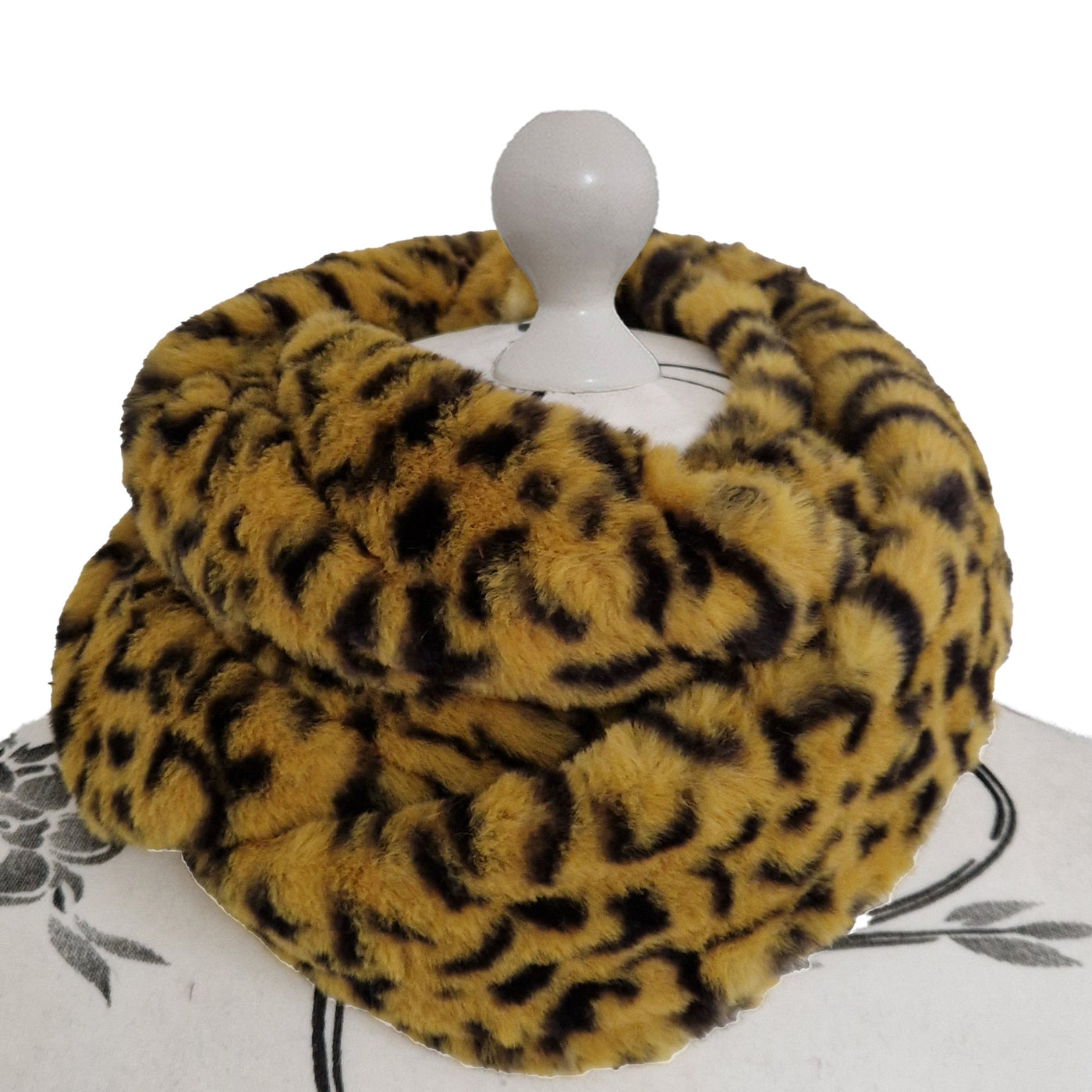 Infinity Scarf handmade from an ultra soft and fluffy leopard faux fur fabric in brown with black markings. Wear it long or wrap it around your neck 2-3 times to keep you toasty warm
