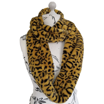 Infinity Scarf handmade from an ultra soft and fluffy leopard faux fur fabric in brown with black markings. Wear it long or wrap it around your neck 2-3 times to keep you toasty warm
