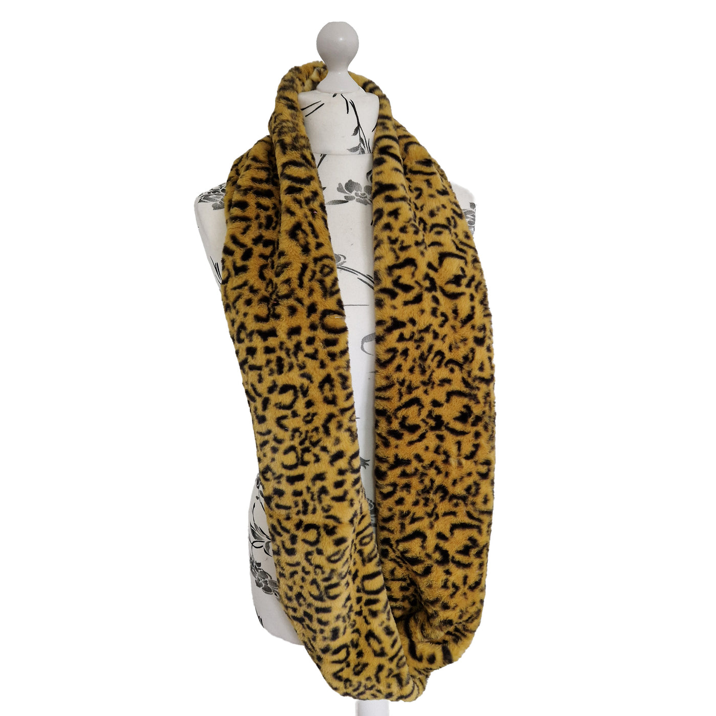 Infinity Scarf handmade from an ultra soft and fluffy leopard faux fur fabric in brown with black markings. Wear it long or wrap it around your neck 2-3 times to keep you toasty warm
