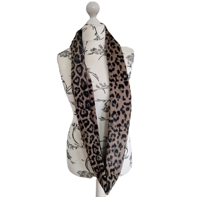 Infinity Scarf handmade from an ultra soft and fluffy microfur leopard print fabric in cream. Wear it long or wrap it around your neck 2-3 times to keep you toasty warm
