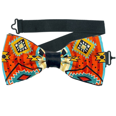 Navajo/Aztec inspired design stripes of brown, turquoise & gold on our pre-tied bow tie which is on a sliding ribbon to easily attach. The pocket square is  25cm x 25cm, pre-folded just pop it straight in your breast pocket Handmade from 100% Cotton
