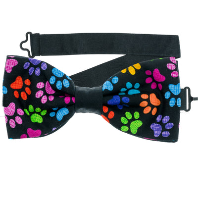 Paw print design with multicoloured paws on black fabric our pre-tied bow tie is handmade from 100% cotton.  
