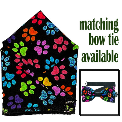 Paw print Design with multi coloured paw prints on black.  Pre-tied bow tie & pre-folded pocket square.  The bow tie is on a sliding ribbon to easily attach. The pocket square is pre-folded for your breast pocket. Handmade from 100% cotton
