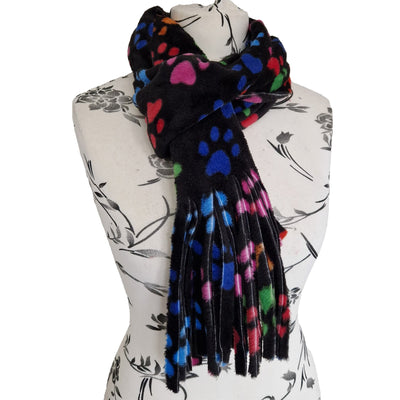 Bright multicoloured paw prints on black fleece fabric in our handmade scarf, approximately 180cm x 28cm with a fringed edge
