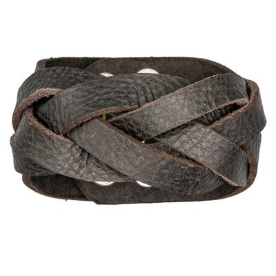 Brown Leather wristband plaited by hand with a 5 strip plait.  The wristband/wrist protector is secured with 2 press studs.  There are 2 size positions.
