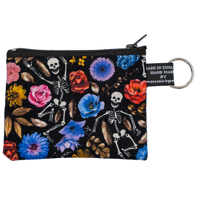 Coin & Card Purse with skeletons dancing in a bed of beautiful flowers in various styles and colours. Design on one side and black cotton on the reverse.  With an optional RFID Insert to block scanners