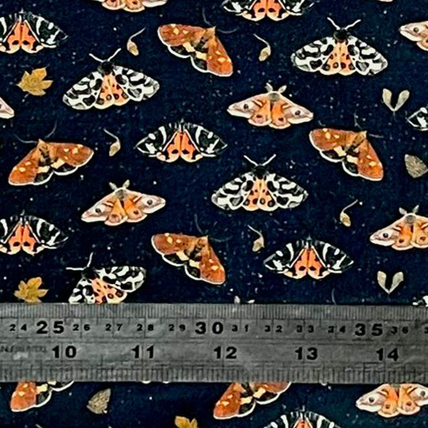 Beautiful fabric covered in tiger moths in various positions with acorns & leaves dotted around.  100% cotton fabric handmade headband