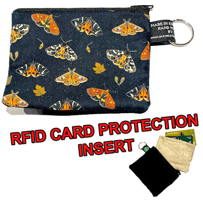 Tiger moths, acorns & leaves cover this designer 100% cotton fabric, handmade into our coin & card purse, lovely autumnal colours on a black background with an RFID Insert to block card scanners