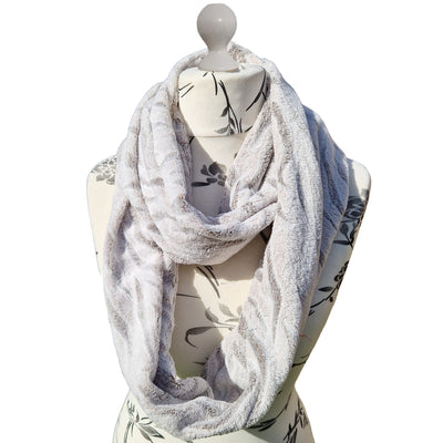 Infinity Scarf handmade from an ultra soft and warm fleece. The fabric is grey with a snow tiger print throughout. Wear it long or wrap it around your neck 2-3 times to keep you toasty warm
