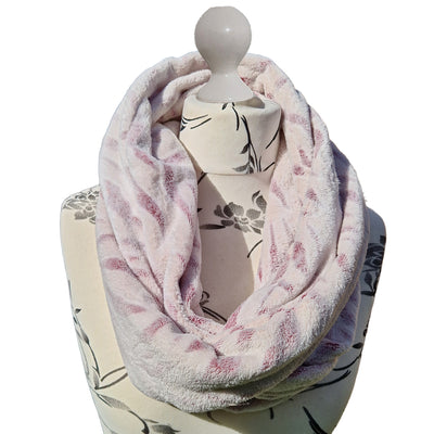 Infinity Scarf handmade from an ultra soft and warm fleece. The fabric is a subtle shade of pink with a snow tiger print throughout. Wear it long or wrap it around your neck 2-3 times to keep you toasty warm
