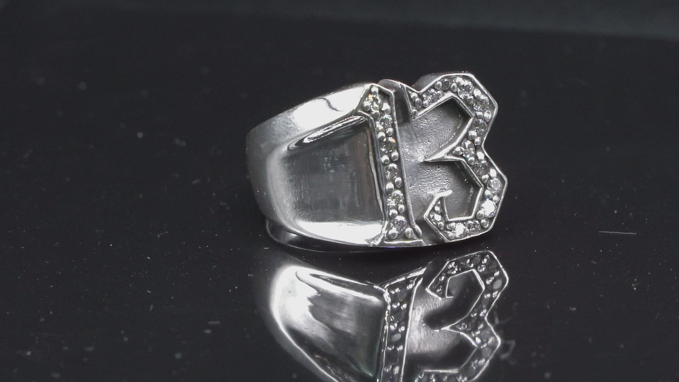 Carved 13 ring made from 925 sterling silver, encrusted in 17 clear  cubic zirconia stones.  Great statement piece, looks great on
