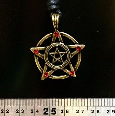 pentagram pendant made in a bronze finish it has a circle around the pentagram with a pentagram in the centre.  a red stone is set at each of the outside points